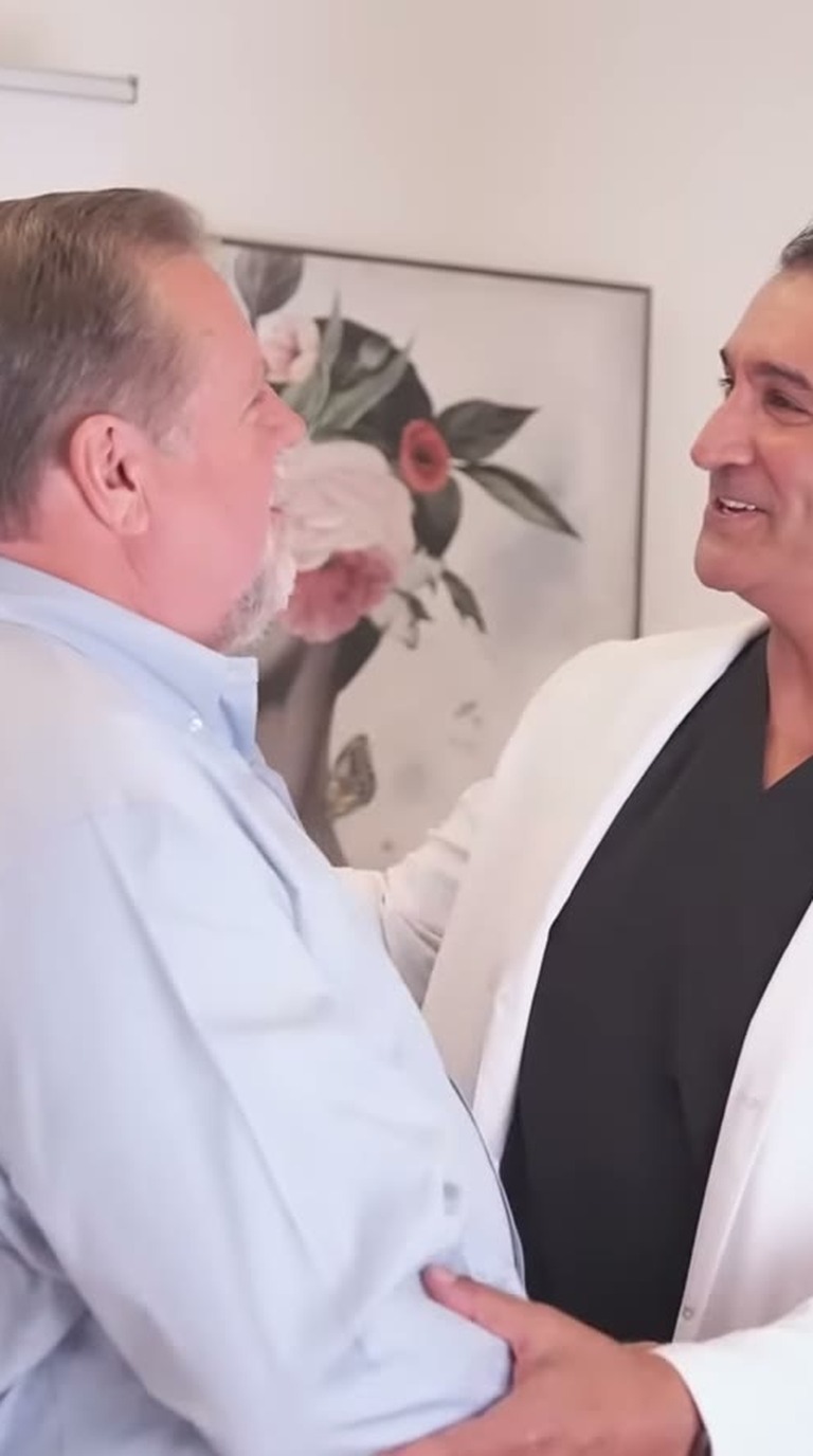 Dr. Abtin Shahriari greeting a patient at ANEWU